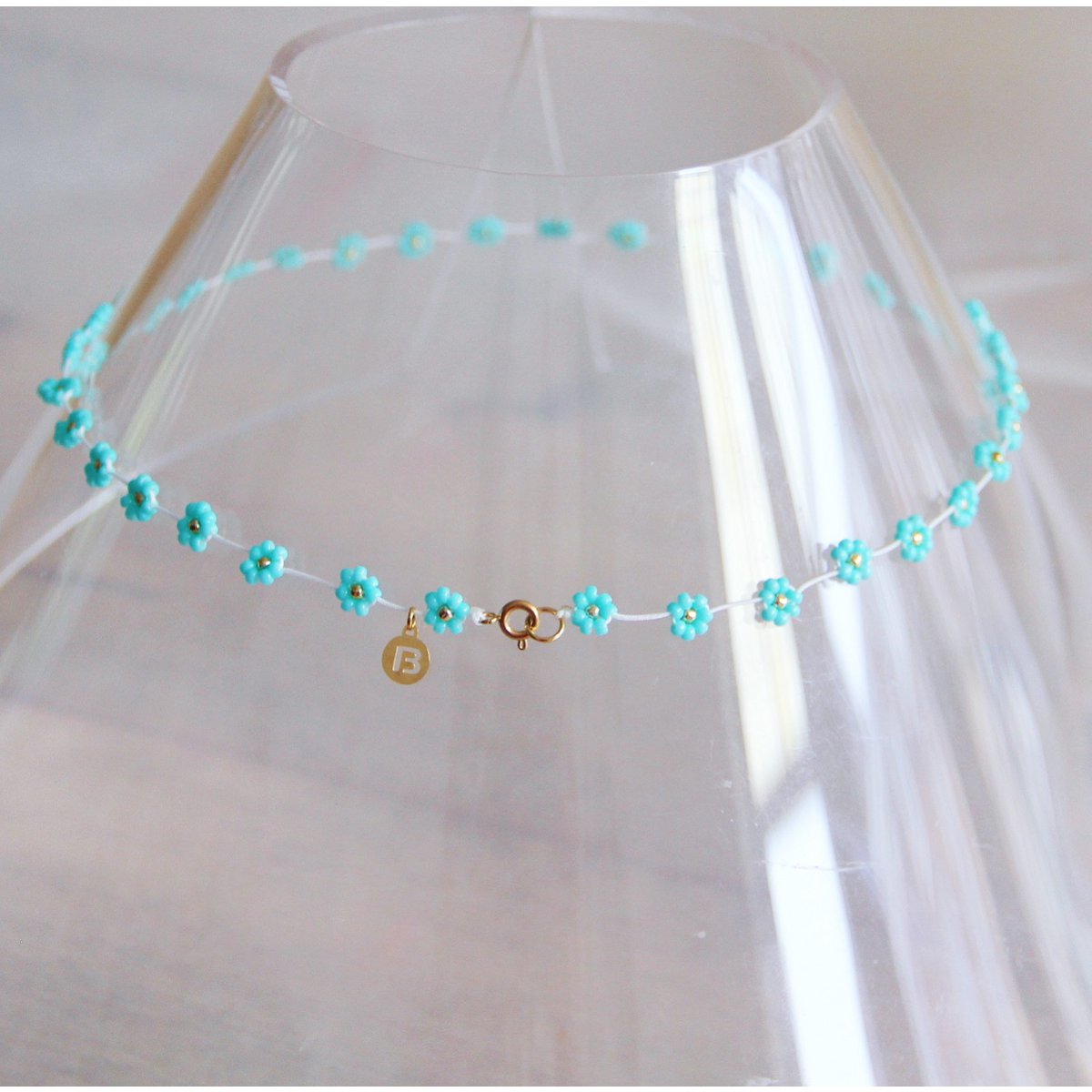 Bazou : halsketting blauwe bloemetjes