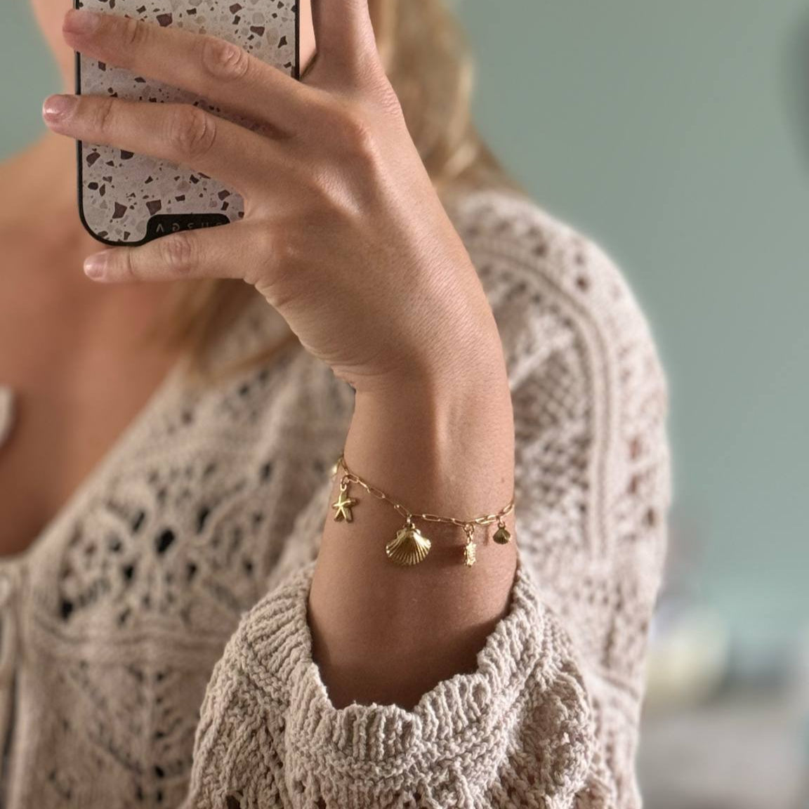 Bedelarmband : schelp - goud