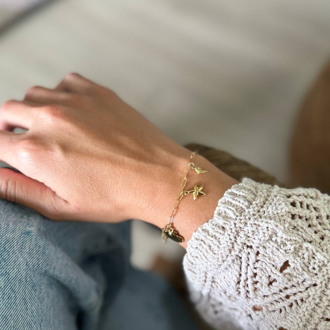 Bedelarmband : schelp - goud