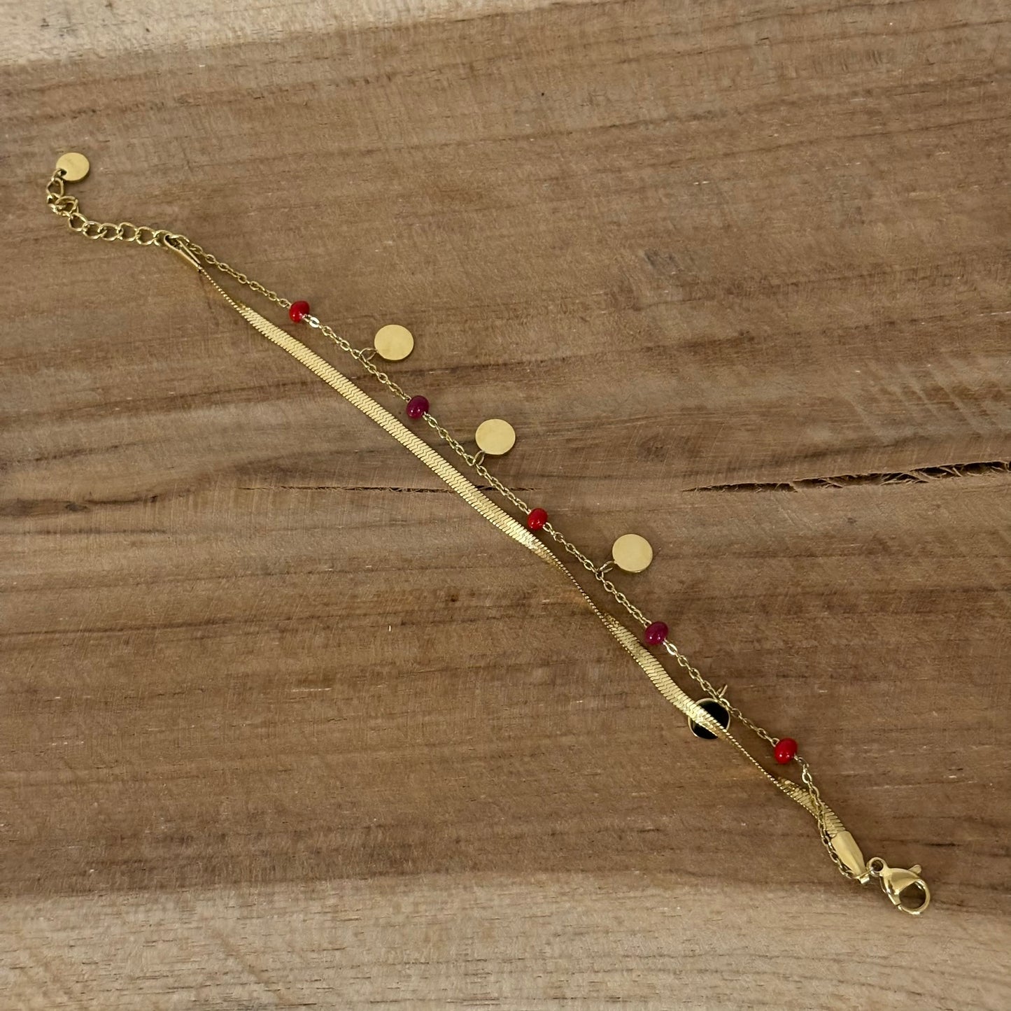 Ikitia : dubbele armband rode kraaltjes in glazen buisje - goud